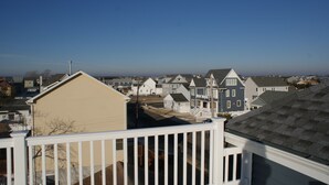 A residential neighborhood with houses and a clear sky.