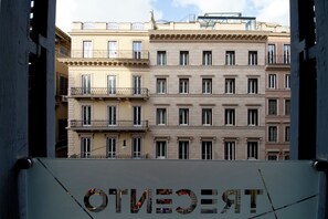 A multi-story building with balconies and windows. - Hotel Trecento (Rome)