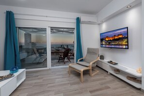 Smart TV, fireplace, books