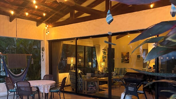 An outdoor patio with a pool, dining area, and a covered seating space. - Casa Da'Vida In Playa Hermosa, Guanacaste, Costa Rica (Playa Hermosa)