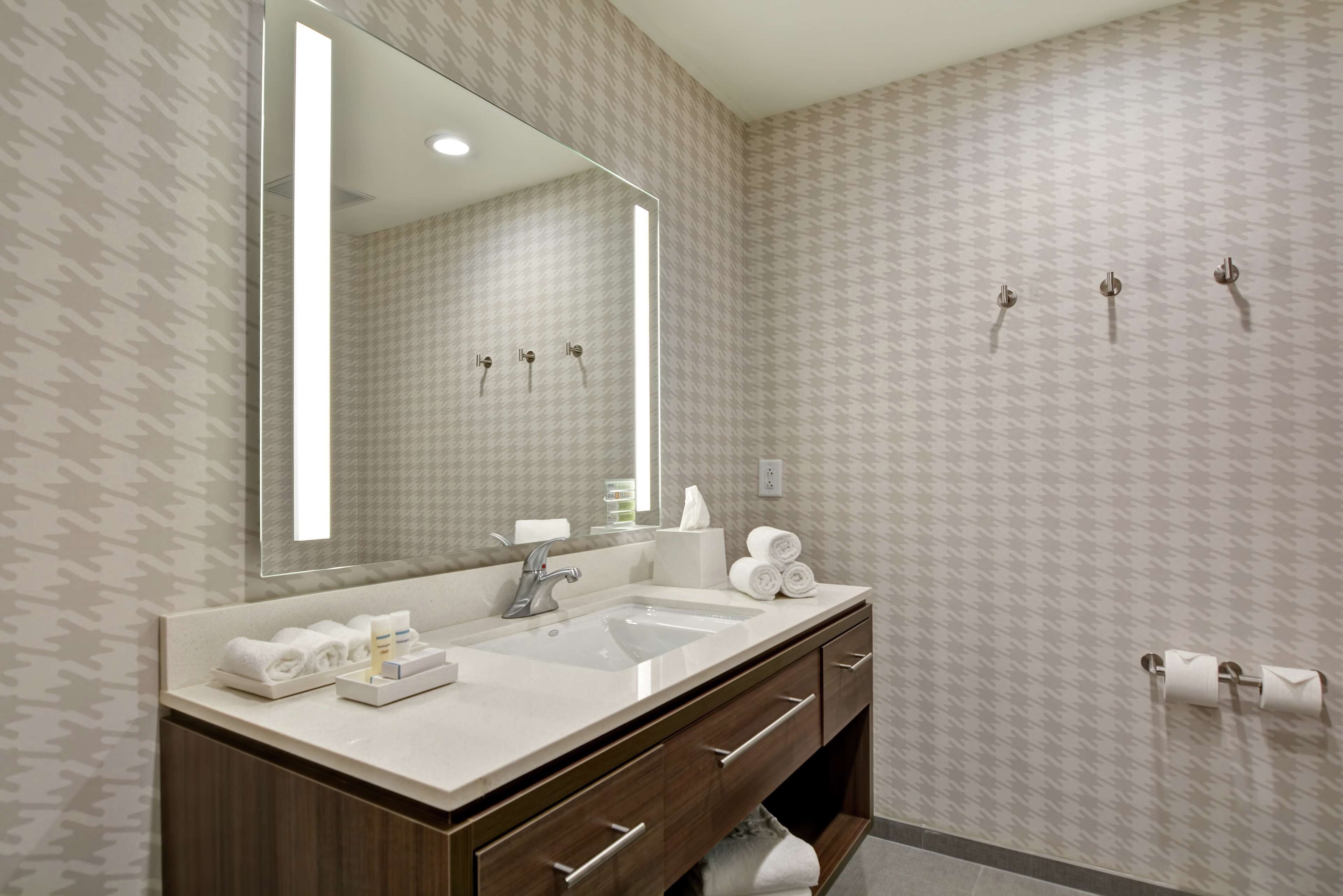 eco-friendly toiletries, hair dryer, towels, soap