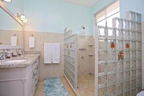 Shower, hair dryer, towels, soap