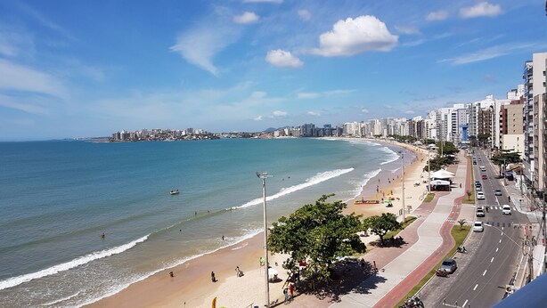 A coastal cityscape with a beach, high-rise buildings, and a clear sky. - INCREADIBLE VIEW! UNFORGETABLE PLACE! YOU MUST TRY IT! (Guarapari)