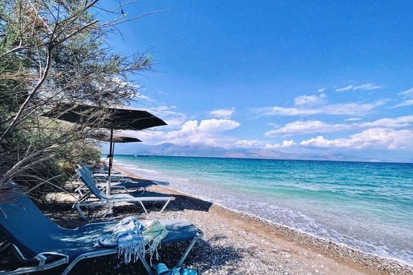 On the beach, sun loungers, beach towels