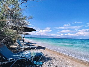 On the beach, sun-loungers, beach towels