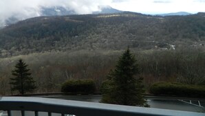 A mountainous landscape with a road and a bridge. - 2nd Floor 'Sky Rise Vista' - Pool Access! (Sugar Mountain)
