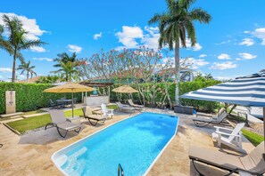 Outdoor pool, a heated pool, pool umbrellas