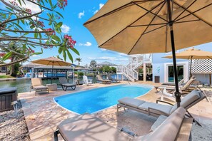 Outdoor pool, a heated pool, pool umbrellas -  Luxury Waterfront Pool Home, Walk to Beach, Kayaks SUP's, Bikes, Pool/PPong Tbl (Marco Island)