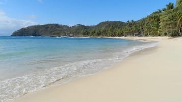 On the beach, sun loungers, beach towels