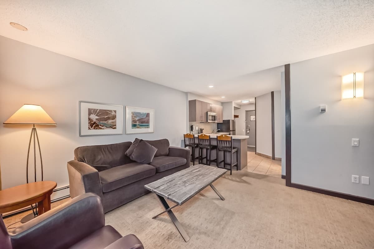 Suite, 1 Bedroom, No AC - fans provided | Living area | Flat-screen TV
