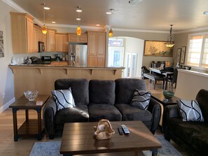 Relax in a well-appointed living space with a cozy seating area and kitchenette.