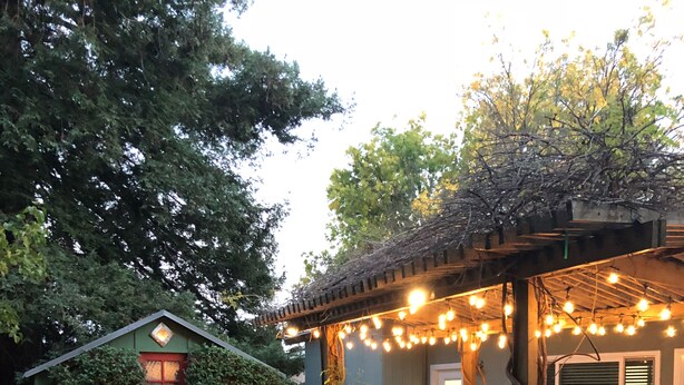 A patio area with a small pond, seating, and string lights. - Ideal for Large Gatherings! Enjoy all that the Central Coasts offers (Atascadero)