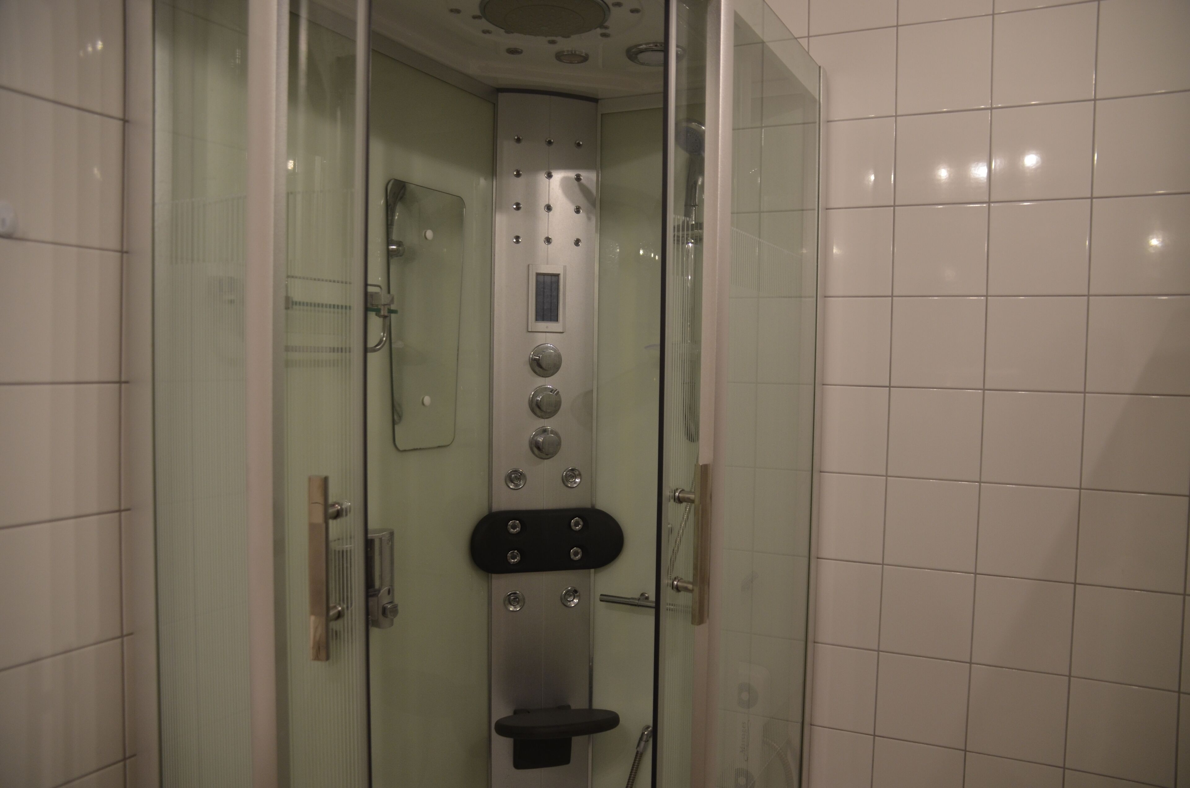 Shower, hair dryer, towels, toilet paper