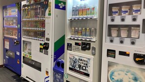 A row of vending machines with various beverages and snacks. - Kesennuma Park Hotel - Adults Only (Kesennuma)