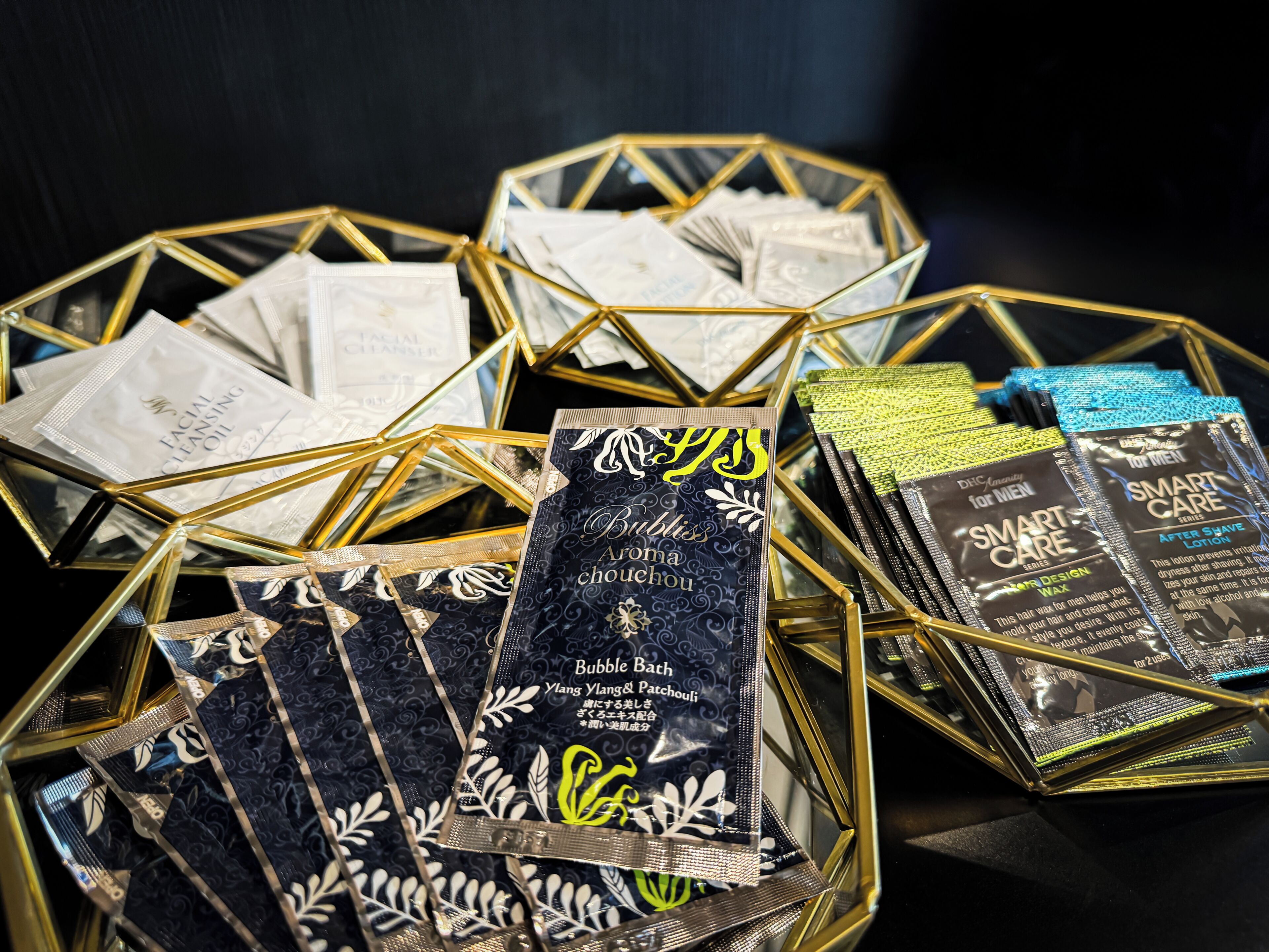 A display of various skincare products in geometric containers.
