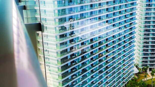 A high-rise hotel with multiple balconies and a pool area. - Albion Residence Haitang Bay Sanya (Sanya)