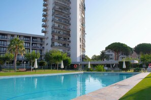 Outdoor pool, open 9:00 AM to 10:00 PM, pool umbrellas
