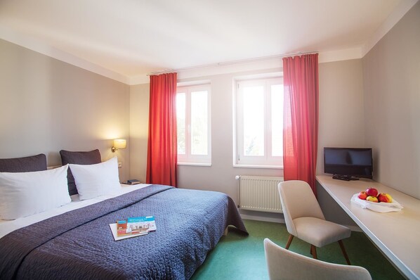 Desk, blackout curtains, free WiFi, bed sheets