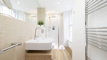 Bathtub, hair dryer, towels