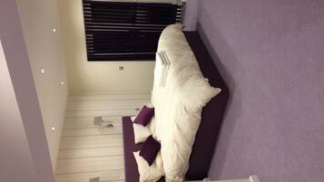 Deluxe Quadruple Room, Multiple Beds, Non Smoking, Garden View | Egyptian cotton sheets, hypo-allergenic bedding, iron/ironing board