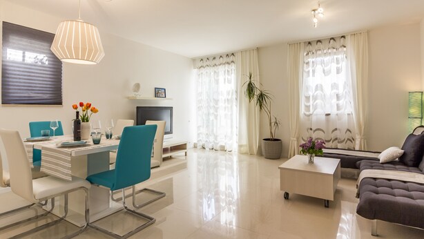 A modern living room with a dining area, a sofa, a coffee table, and a TV. - Forest&Sea apartment-Bikes&table incl (Medulin)