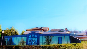 A modern building with large glass windows and a flat roof. - VVF Lac Léman, Évian-les-Bains (Evian-les-Bains)