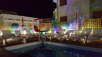 Outdoor pool, open 11:00 AM to 6:00 PM, pool umbrellas, pool loungers