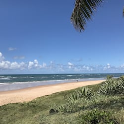 On the beach, white sand, beach umbrellas, beach towels