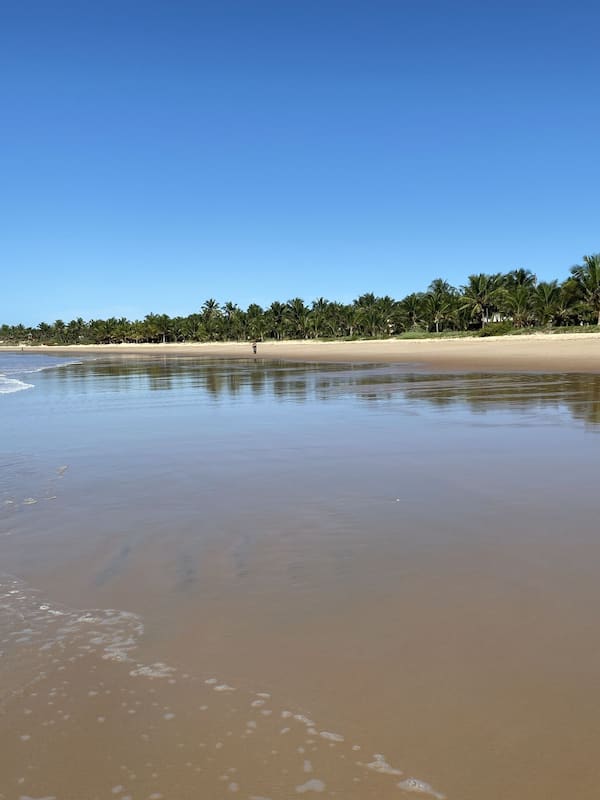 On the beach, white sand, beach umbrellas, beach towels