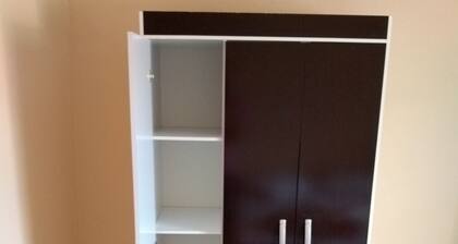 Room with double bed, bathroom and TV