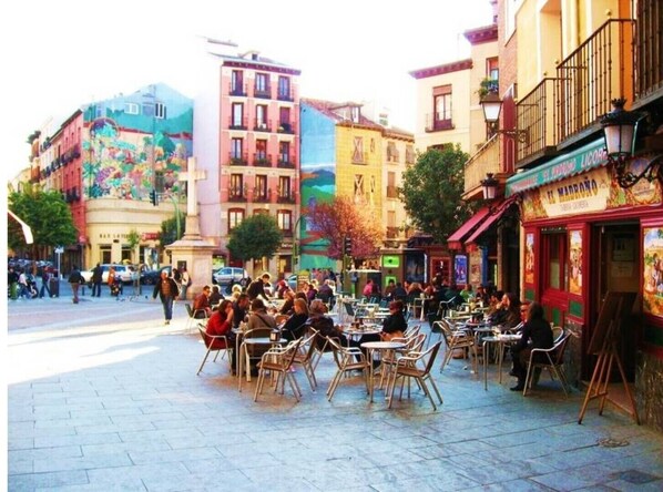 Enjoy a lively atmosphere in our outdoor café area, surrounded by urban charm and bustling activity.