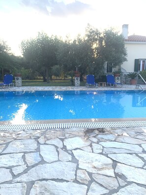 Seasonal outdoor pool, open 9:00 AM to 9:00 PM, pool loungers