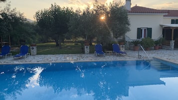 Seasonal outdoor pool, open 9:00 AM to 9:00 PM, pool loungers