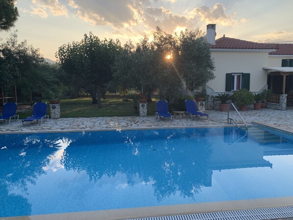 Seasonal outdoor pool, open 9:00 AM to 9:00 PM, pool loungers