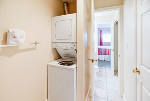 Convenient laundry facilities with a front-loading washer and dryer.