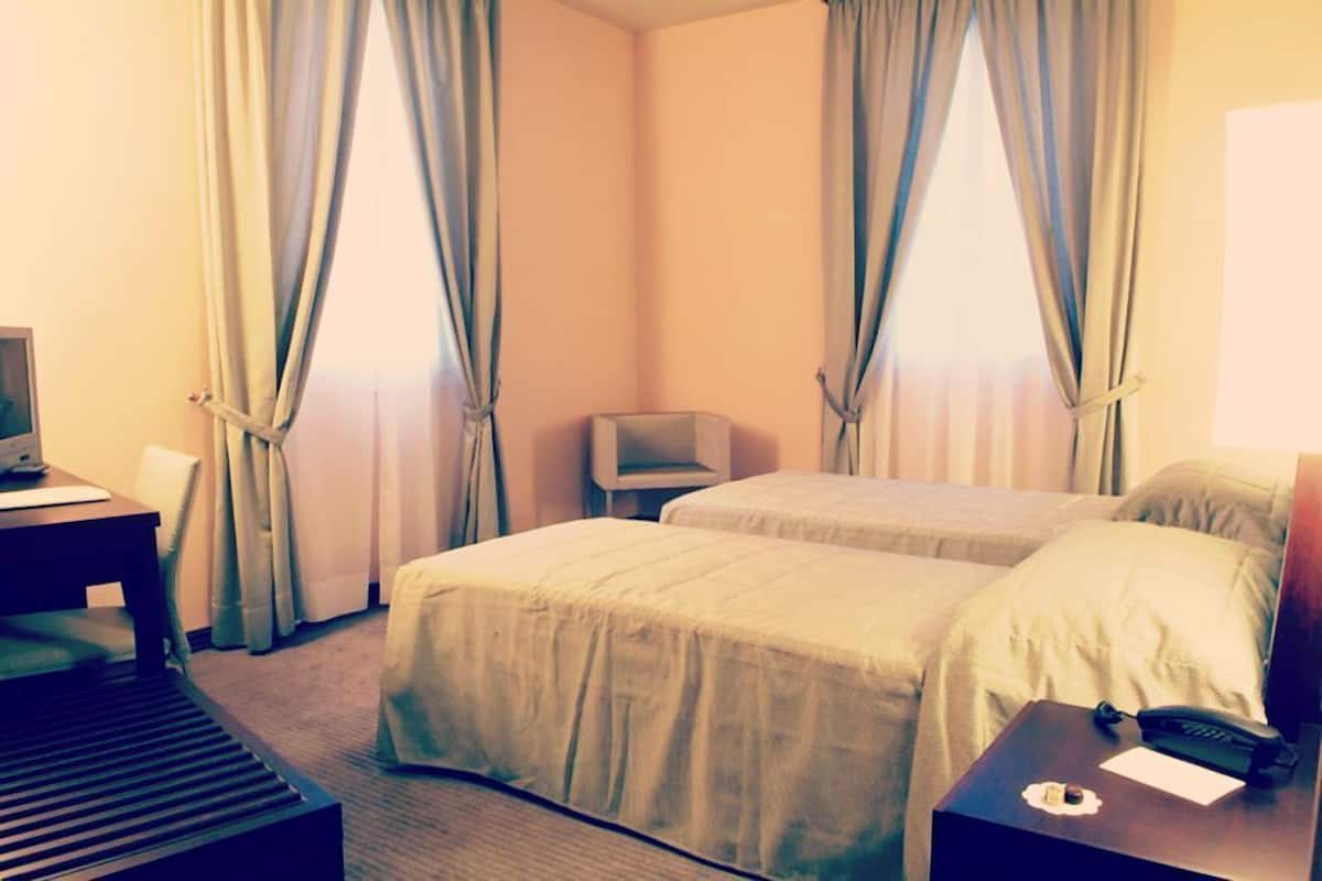 twin room, 2 single beds | 1 bedroom, minibar, in-room safe, desk