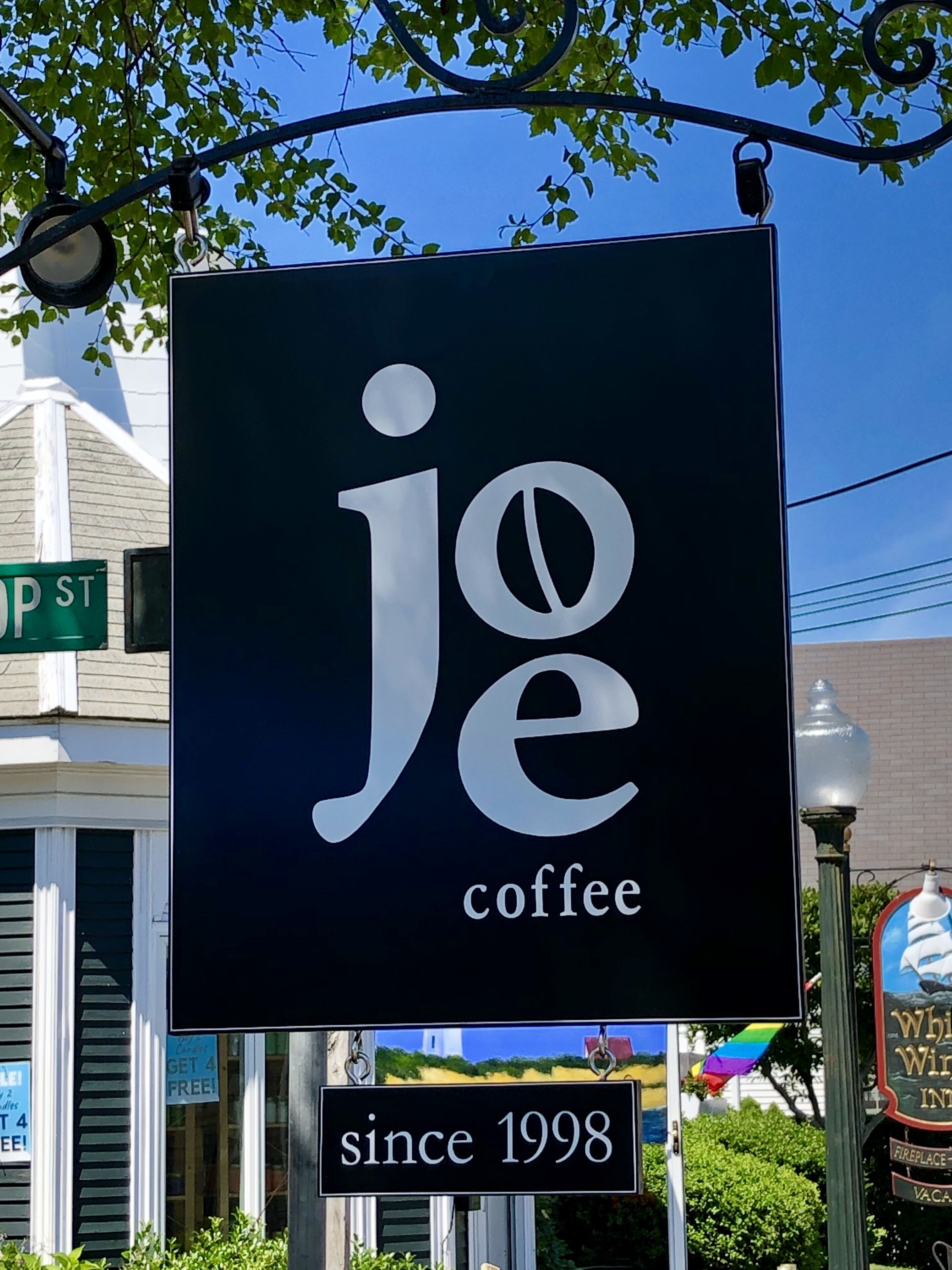 A sign for 'Joe Coffee' with the text 'since 1998' below it.