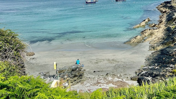 A coastal landscape with clear blue waters, boats, and rocky terrain. - Historic Townhouse in Clifden with courtyard+ balcony overlooking
Clifden Bay (Clifden)