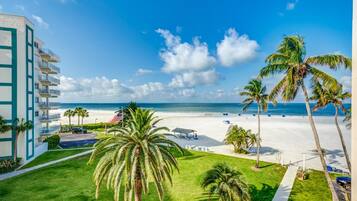 On the beach, sun loungers, beach towels