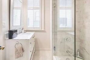 Combined shower/tub, hair dryer, towels, soap