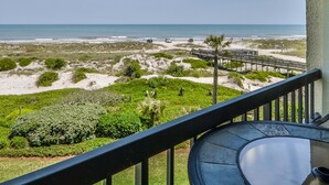 A balcony with a view of the beach, sandy dunes, and a wooden boardwalk. - Beautiful Oceanfront Condo With Breathtaking Beach Views , 3RD floor, C117 (Fernandina Beach)