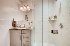 Combined shower/tub, hair dryer, towels, soap