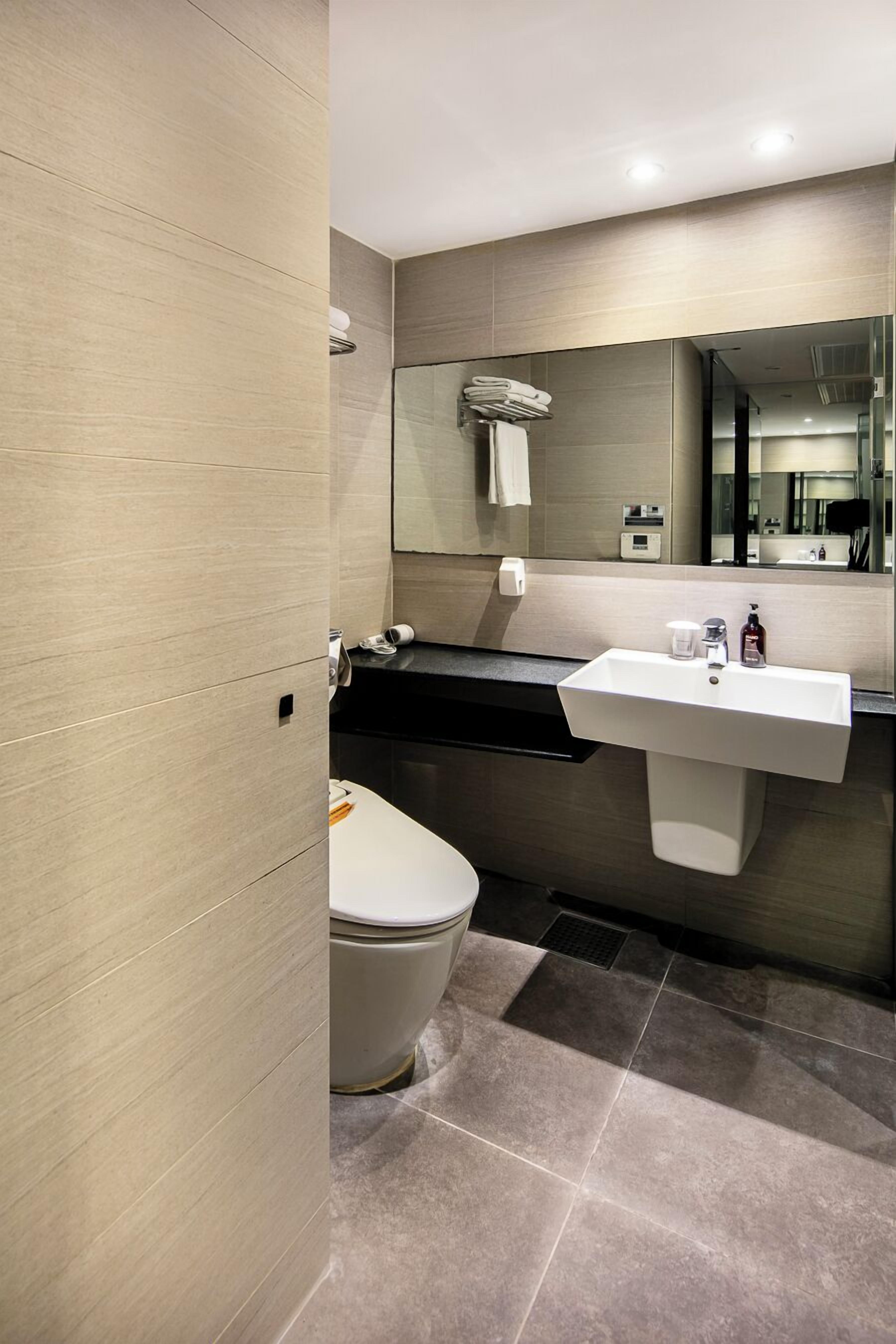 shower, hair dryer, slippers, bidet