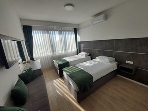Deluxe Double or Twin Room, Non Smoking, City View | 2 bedrooms, desk, free WiFi, bed sheets