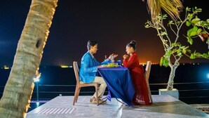 A couple dining at an outdoor table with a view of the water. - Lagoon Bay Negombo (Negombo)