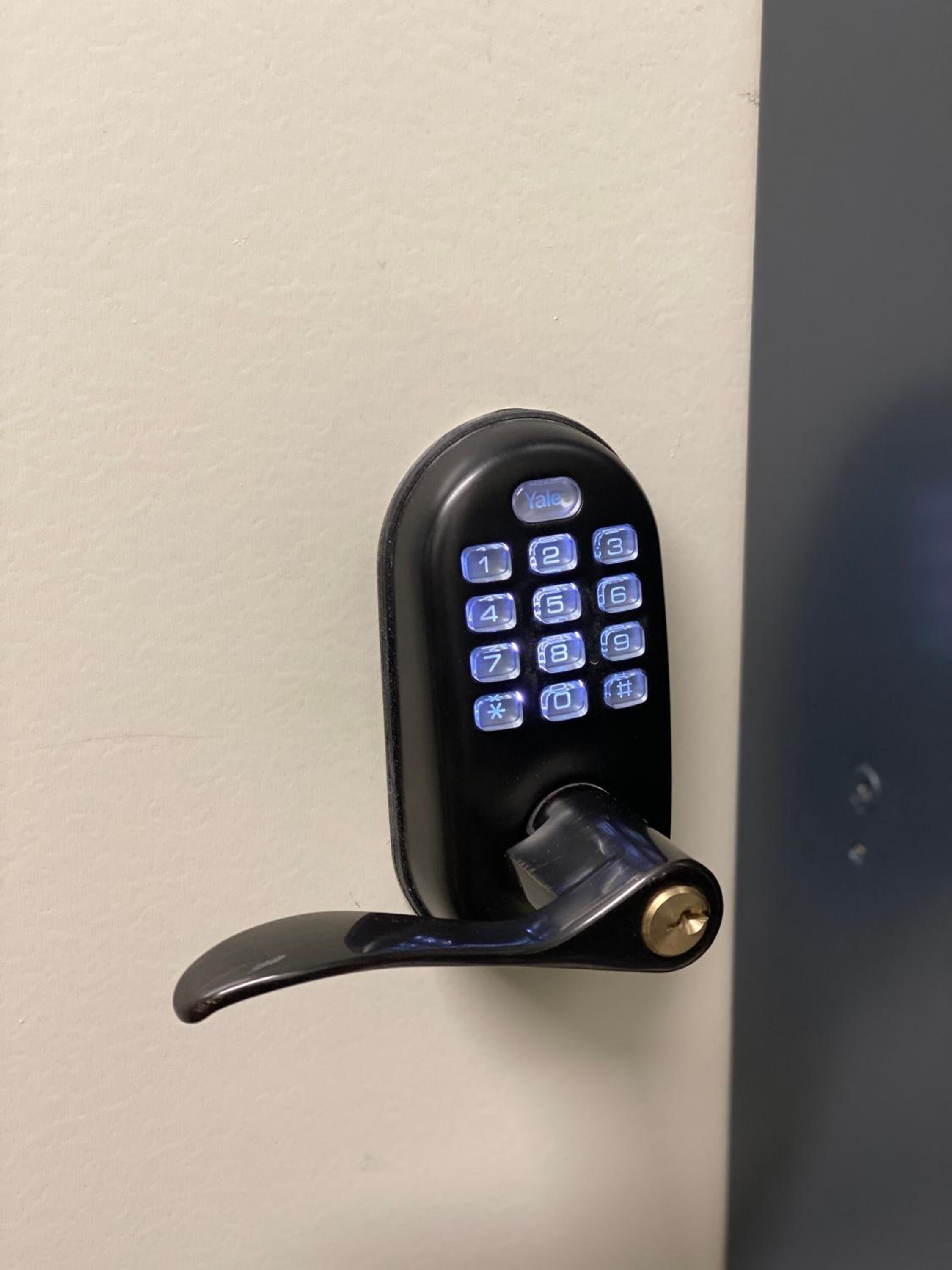 A numeric keypad lock on a door.