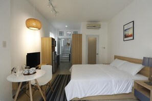 Suíte estúdio executiva | Wi-Fi de cortesia, roupa de cama