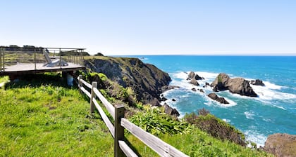Oceanfront cottage with deck, stunning 180-degree views & 7.5 acres