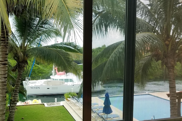 Enjoy a view from the Penthouse condo livingroom; as you watch the yachts go by.