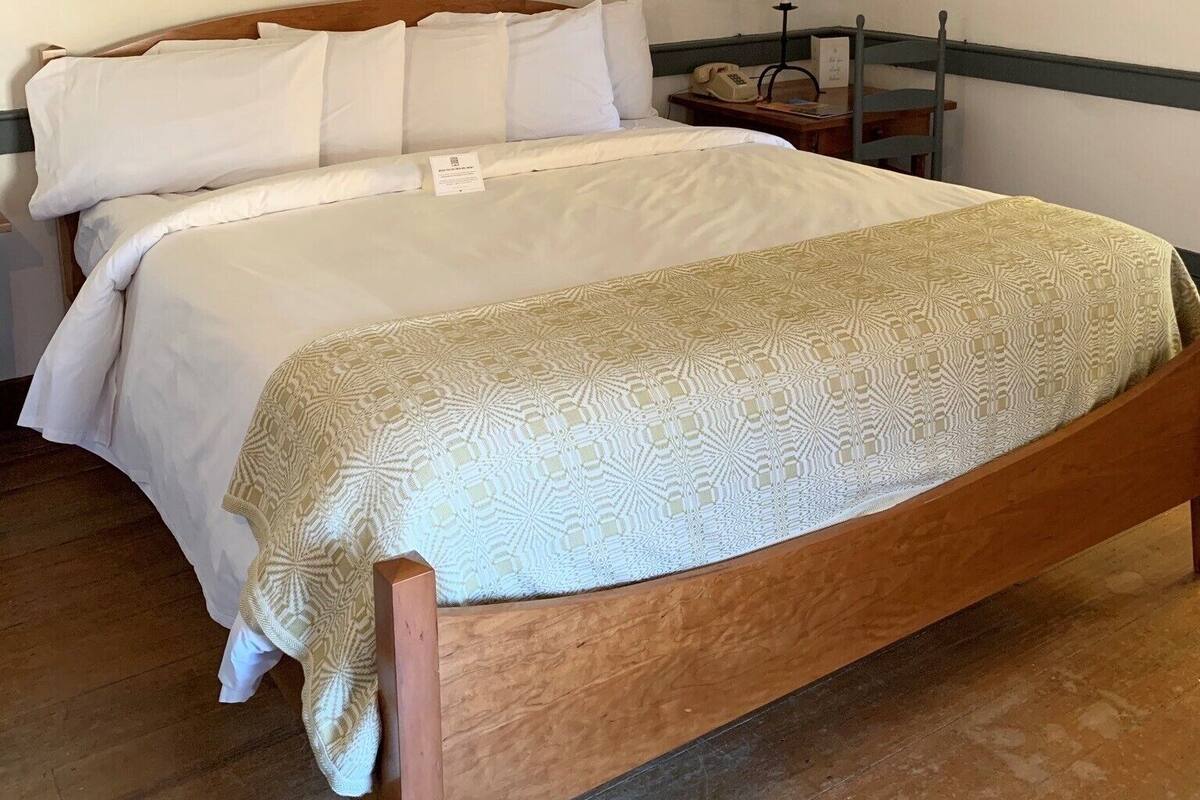 Desk, blackout drapes, iron/ironing board, individually decorated
